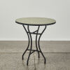 A Metal Base Indoor/Outdoor Table with Circular Tile Inlay