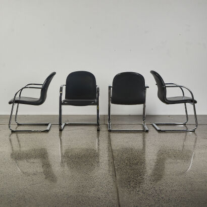 A Suite Of Four Italian Chrome & Black Leather Cantilever Chairs