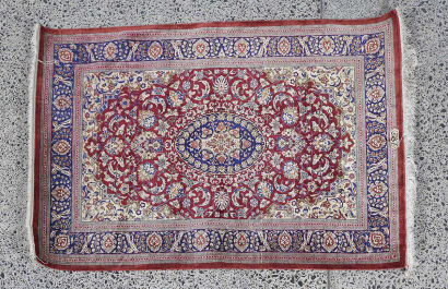 A Hand-Knotted Qum Silk Rug
