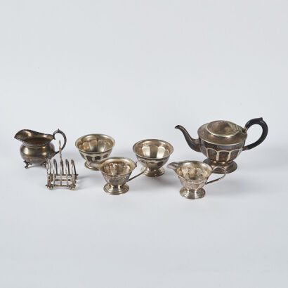 A Silver Plated Tea Set With Toast Stand