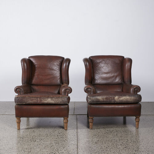 A Pair Of Leather Cigar Chairs