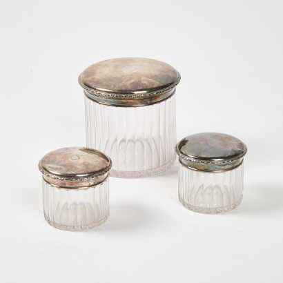 A Trio of Glass Jars with Sterling Silver Lids