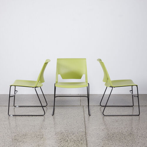 A Trio Of Green Designer Chairs With Black Sleigh Base