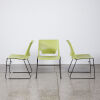 A Trio Of Green Designer Chairs With Black Sleigh Base