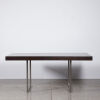 A Minimal Contemporary Table With Stainless Legs & Oak Top