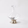 A Glass Decanter With A Conical Base With A Stainless Cradle