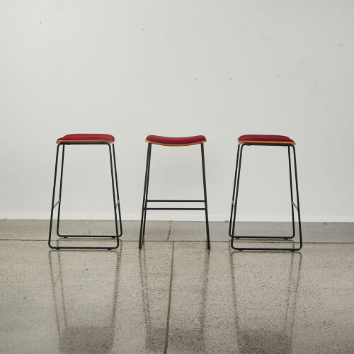 A Set Of Three Designer Formed Ply Barstools With A Metal Sleigh Base