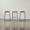 A Set Of Three Designer Formed Ply Barstools With A Metal Sleigh Base