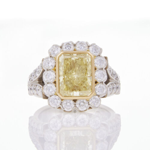 Platinum and 18ct Yellow Gold, 4.31ct Fancy Yellow Radiant Cut Diamond Ring