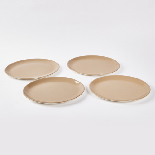 A Set Of Four Oval Crown Lynn Dinner Plates