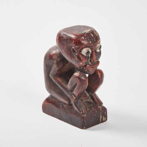 A Small Crouching Folk Art Figure