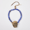 A Beaded Necklace with a Skull Ornament