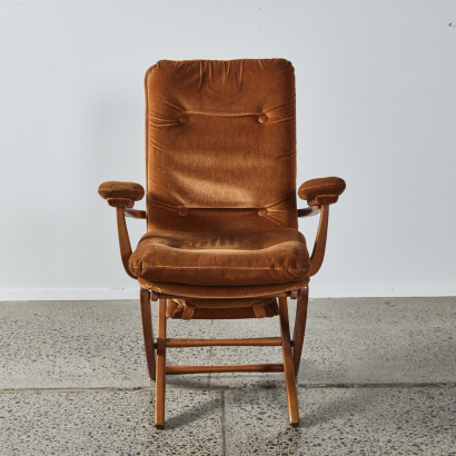 A Mid Century Wood And Velvet Reclining Chair