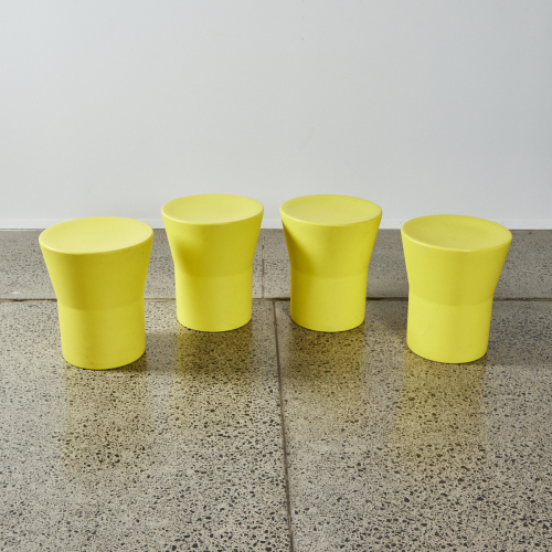 A Collection Of Four Yellow Indoor/Outdoor Stools