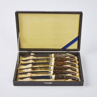 A Set Of Six Vintage Faux Antler Handle Steak Knives