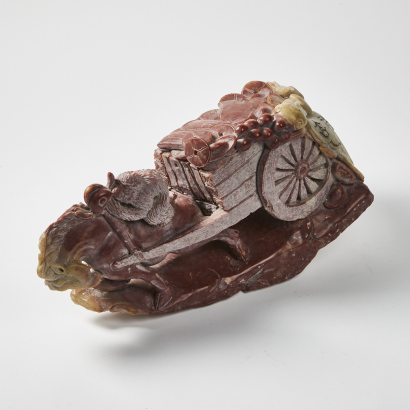 A Large Chinese Red Jade Carving Of A Horse And Cart