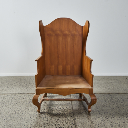 A Vintage Wooden Wing Chair