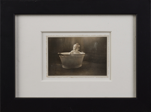 A Photography of a Baby in a Tin Tub