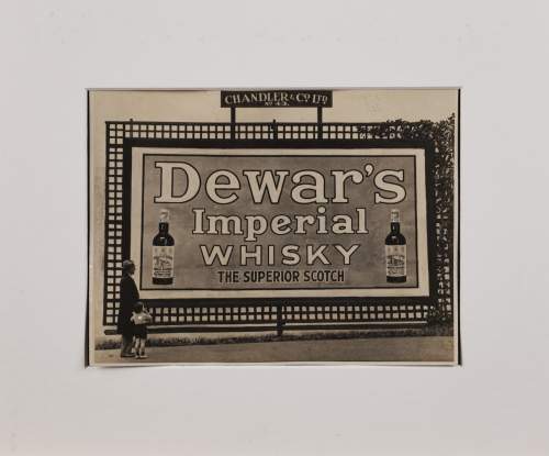 A Photograph of a Billboard Advertising Dewar's Whisky 