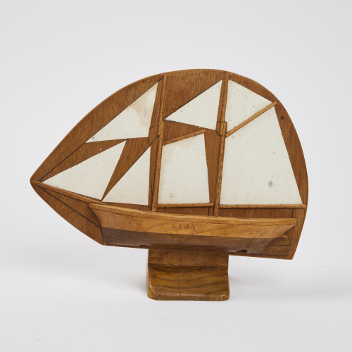 A Crafted Wood Boat by L. Ricketts