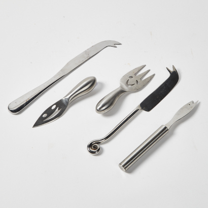 A Collection Of Five Cheese Knives