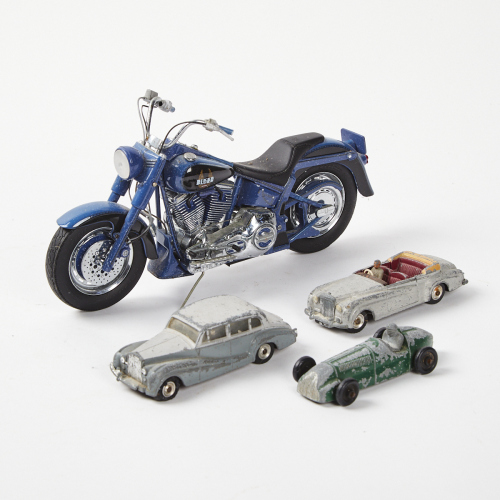 A Model Harley Davidson and Three Model Cars