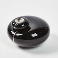 A Black Art Glass Abstract Flattened Orb Form