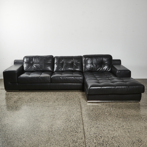 A Contemporary Black Leather Chaise Couch