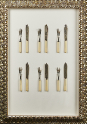A Set Of Six Bone Handled Knives And Forks In A Frame