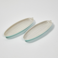 A Pair Of Poole Twin Tone Cucumber Dishes