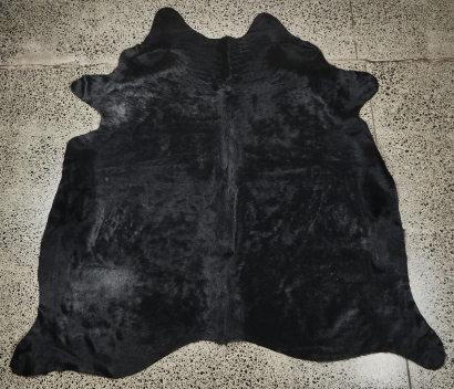 A Black Cowhide Rug