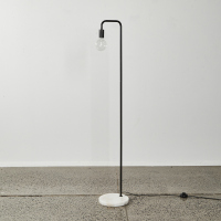 A Floor Lamp With A White Marble Base