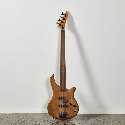 A Washburn Fretless Bass Guitar Natural Wood Finish