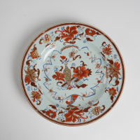 A Chinese early-mid Qing dynasty gilt-decorated and iron-red 'floral' large plate