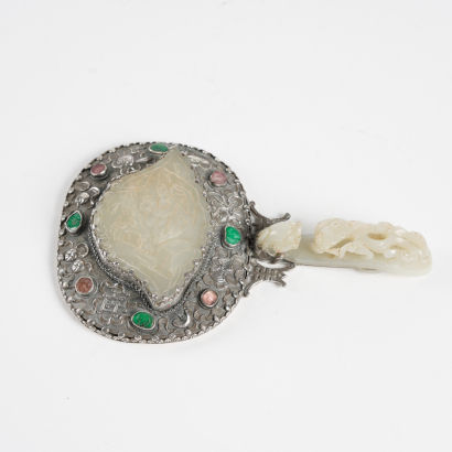 A Chinese Qing dynasty sterling silver handle mirror inlaid with Hetian jade