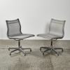 A Pair Charles And Ray Eames EA330 Aluminium Group Mesh Chairs