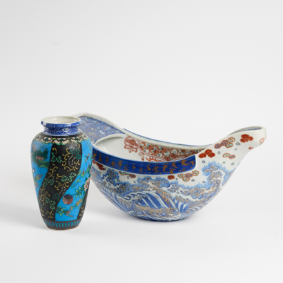 A Japanese Meiji period blue and white polychrome-enamelled porcelain boat + A Japanese Meiji period blue and white enamelled porcelain vase