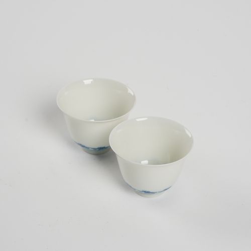 A pair of Chinese Qing dynasty blue and white 'eggshell' cups