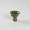 A Chinese Yuan dynasty Longquan celadon-glazed 'figural' octagonal cup