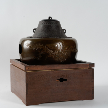 A Japanese Meiji period carved tea kettle with phoenix