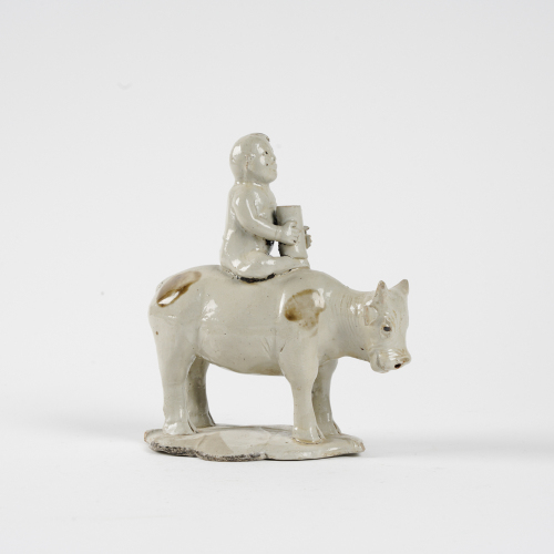 A Chinese Song dynasty Ding Kiln 'A shepherd boy riding cow' ornament
