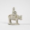 A Chinese Song dynasty Ding Kiln 'A shepherd boy riding cow' ornament