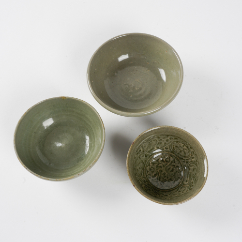 A set of three Chinese Ming dynasty celadon-glazed bowls