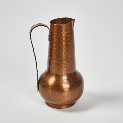 A Hand Beaten Copper Jug