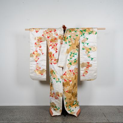 A Japanese Meiji period hand-embroidered silk-fabric wedding kimono with cherry blossom and crane pattern