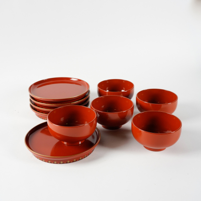 A group of ten Japanese red lacquer dishes, bowls