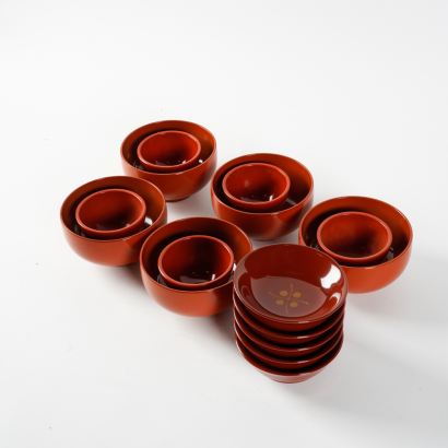 A group of fifteen Japanese red lacquer dishes, bowls