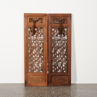 A pair of Chinese Qing Dynasty carved wooden panels