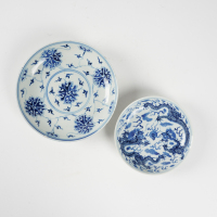 A Chinese Qing dynasty blue and white saucer and a blue and white 'dragon' dish (Guangxu stamp) (Kangxi stamp)