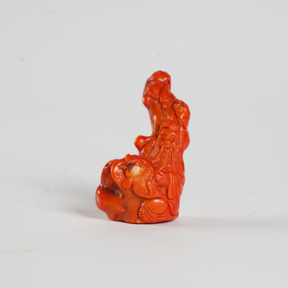 A Chinese carved coral 'Longevity Immortal' ornament